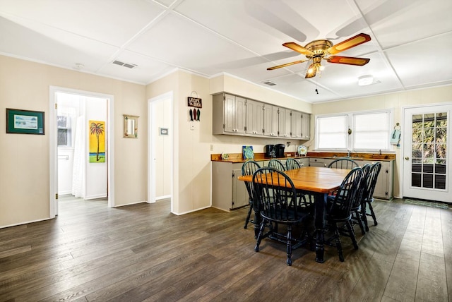 dining room featuring ceiling fan and dark hardwood / wood-style flooring