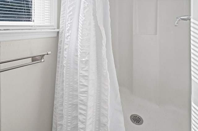 bathroom with curtained shower