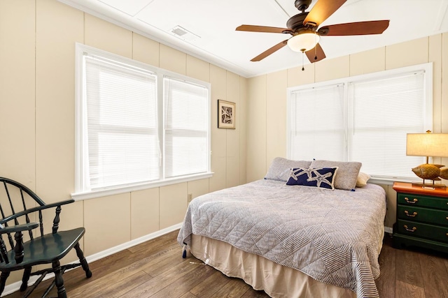 bedroom with wood-type flooring and ceiling fan