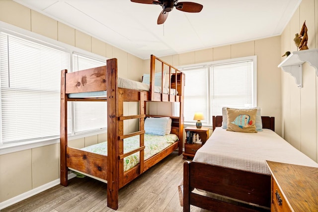 bedroom with ceiling fan and light hardwood / wood-style floors