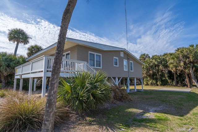 view of side of property featuring a deck