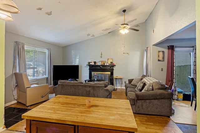 living room featuring high vaulted ceiling, wood-type flooring, and ceiling fan