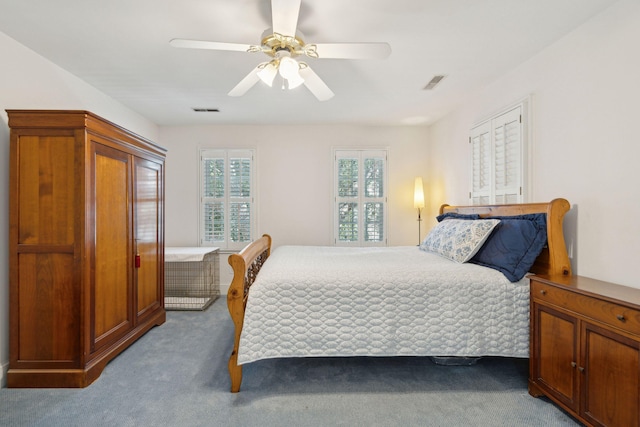 bedroom featuring light carpet and ceiling fan