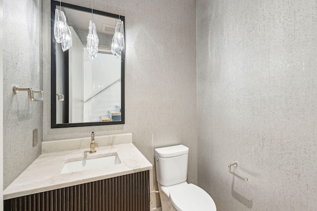 bathroom with vanity and toilet