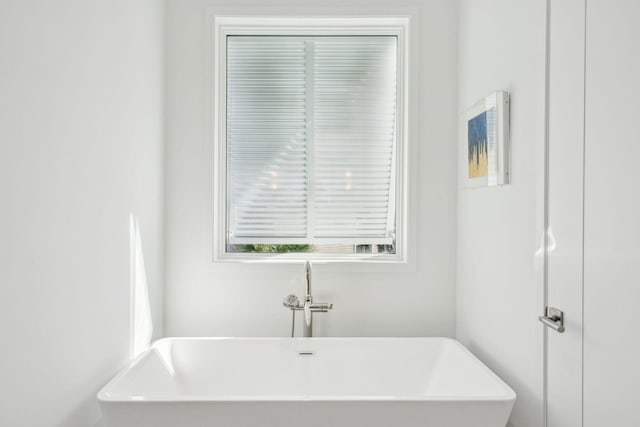 bathroom featuring a bathtub and sink