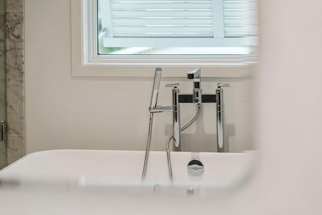 room details featuring a bathing tub