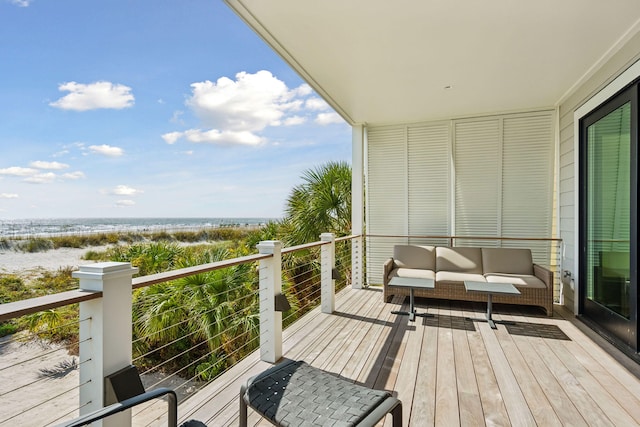 balcony featuring a water view and an outdoor hangout area