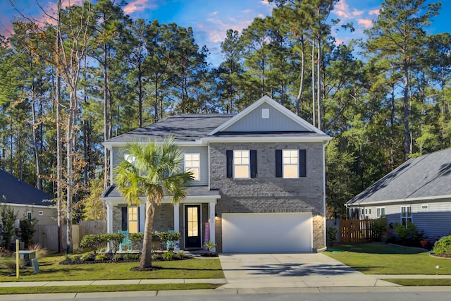 view of front of house featuring a lawn and a garage