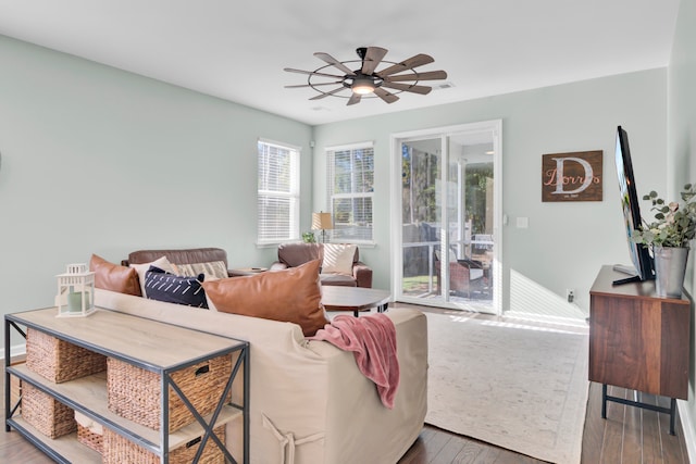 living room featuring ceiling fan and wood-type flooring