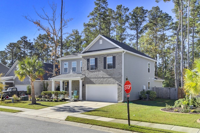 view of front of property featuring a garage and a front lawn