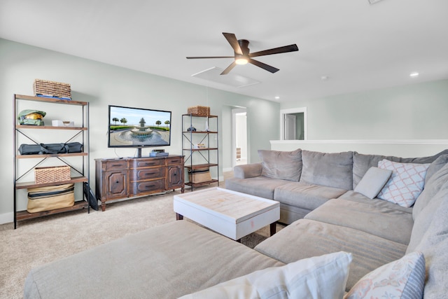 carpeted living room featuring ceiling fan