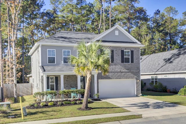 view of front of house with a front yard and a garage