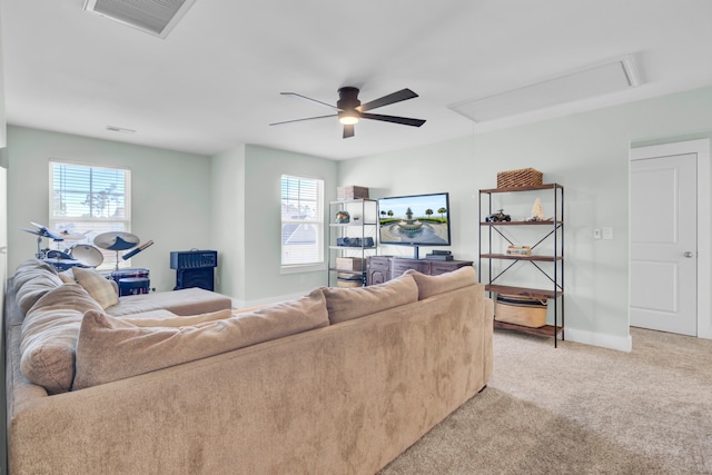 living room featuring light carpet and ceiling fan