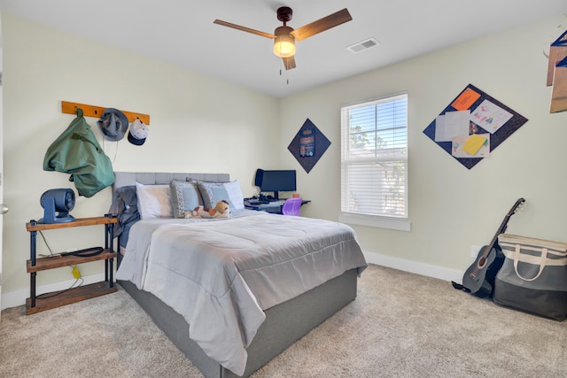 carpeted bedroom with ceiling fan