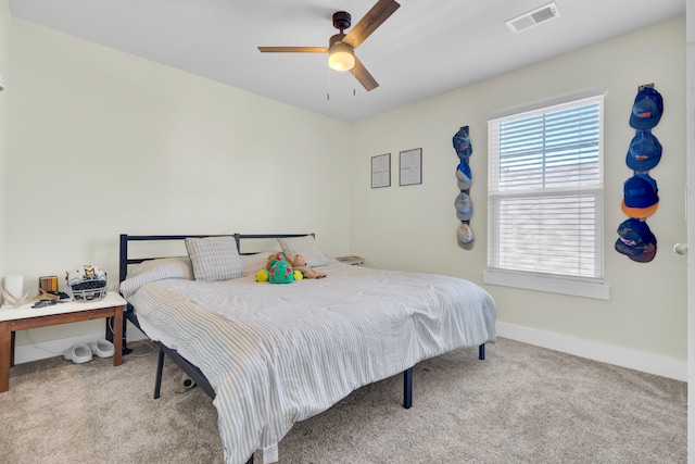 carpeted bedroom featuring ceiling fan