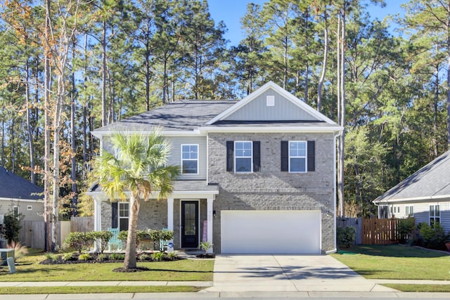 view of front facade with a front yard and a garage