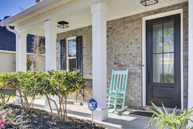 entrance to property featuring a porch