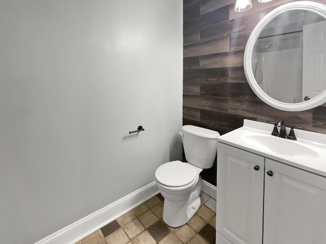 932 Portabella Ln, Charleston, SC 29412 - bathroom featuring vanity, toilet, tile patterned flooring, wood walls, and baseboards