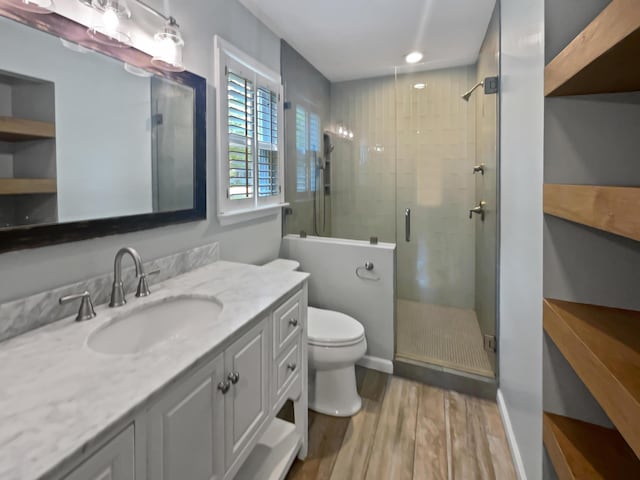 932 Portabella Ln, Charleston, SC 29412 - full bath with wood finished floors, toilet, a stall shower, vanity, and recessed lighting