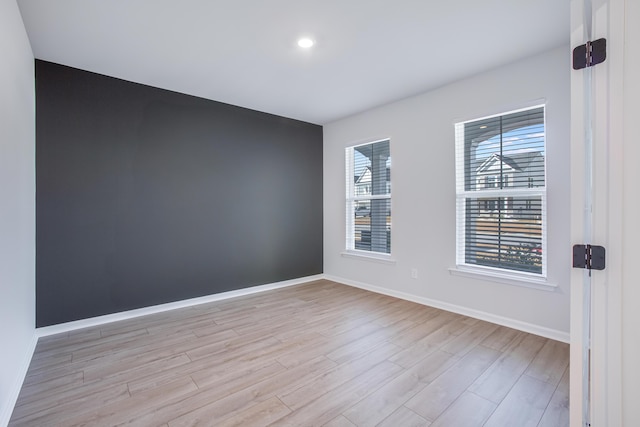 empty room with light hardwood / wood-style floors