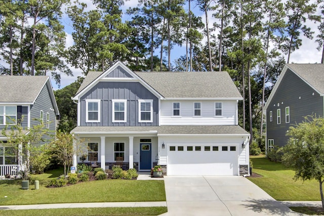 craftsman house featuring a porch, a garage, and a front yard