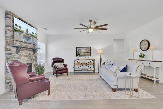 kitchen with appliances with stainless steel finishes, white cabinets, pendant lighting, a center island with sink, and sink