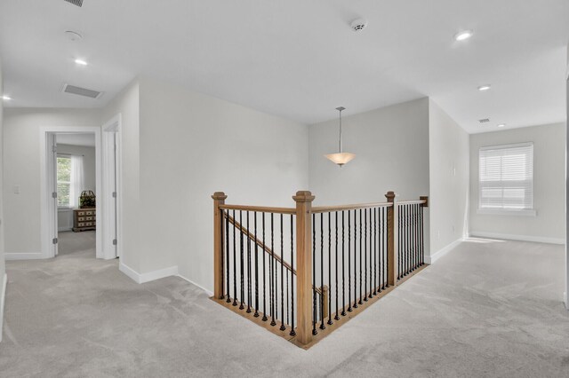 interior details featuring wood-type flooring and a stone fireplace