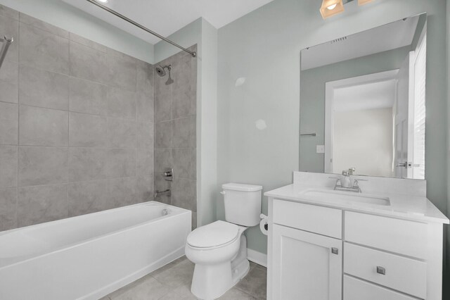 bedroom featuring ensuite bath and light carpet