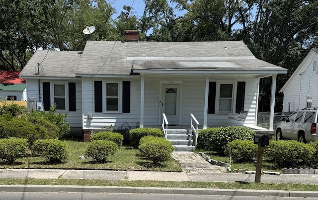 505 Blacks St, Walterboro, SC 29488 - view of front of house with covered porch, a chimney, and roof with shingles