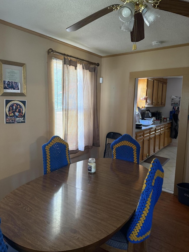 505 Blacks St, Walterboro, SC 29488 - dining space featuring a ceiling fan, a textured ceiling, crown molding, and light wood-type flooring