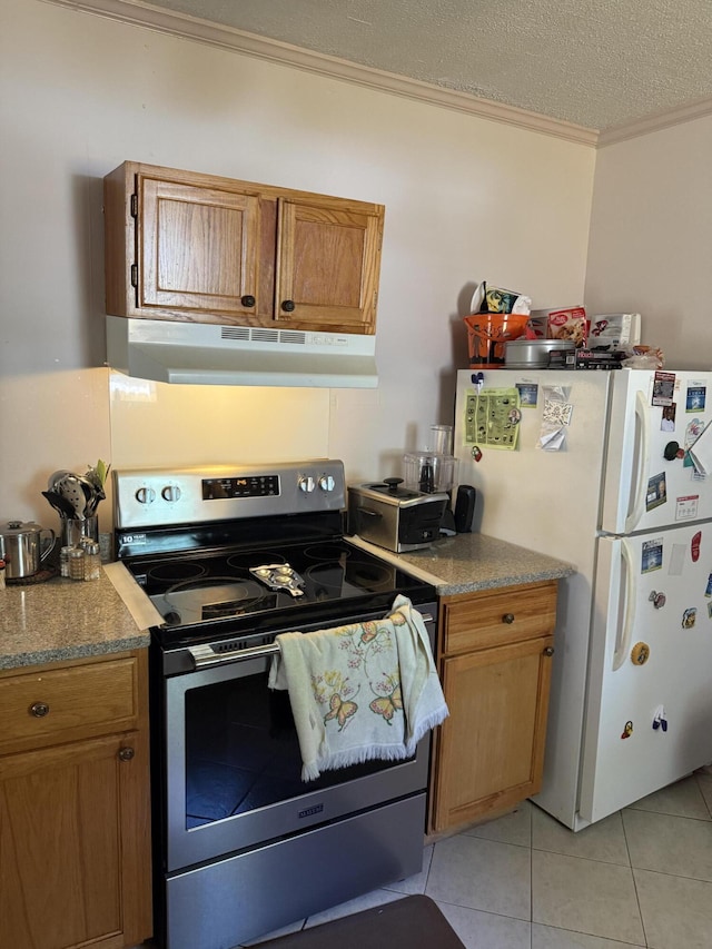 505 Blacks St, Walterboro, SC 29488 - kitchen featuring stainless steel electric range oven, freestanding refrigerator, under cabinet range hood, ornamental molding, and light tile patterned floors
