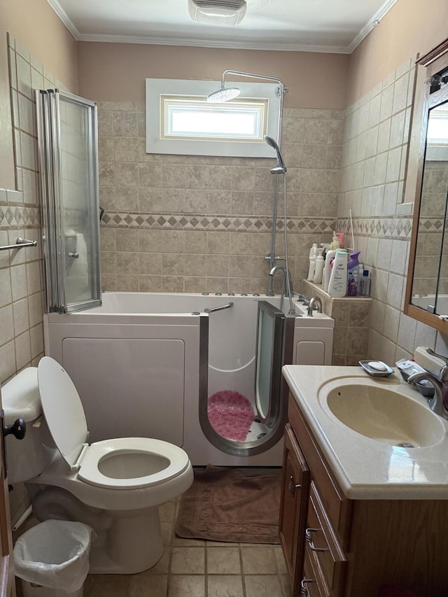505 Blacks St, Walterboro, SC 29488 - full bathroom with tile walls, toilet, vanity, ornamental molding, and tile patterned flooring