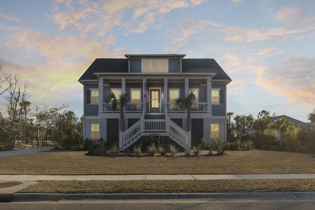 coastal home with a porch and stairway