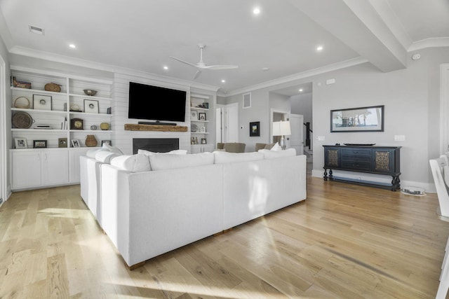 living area with ceiling fan, recessed lighting, light wood-type flooring, and crown molding