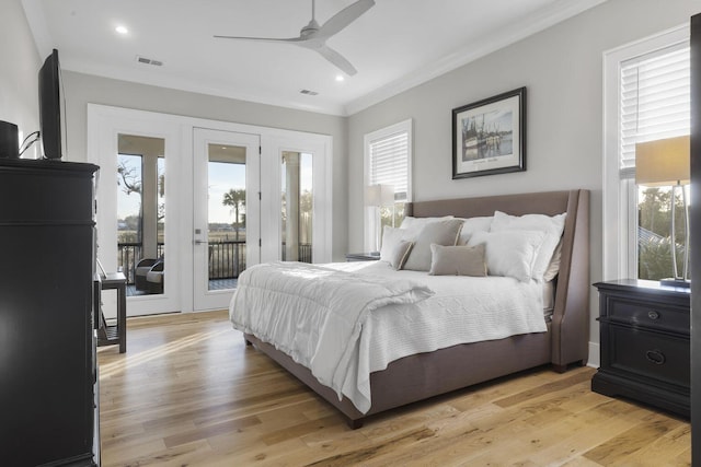 bedroom with ornamental molding, access to outside, light wood finished floors, and visible vents