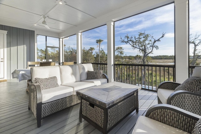 sunroom / solarium with ceiling fan