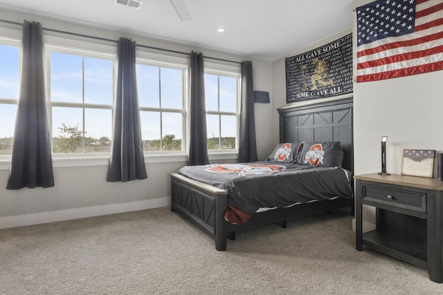 bedroom featuring recessed lighting, light colored carpet, visible vents, and baseboards