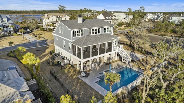 birds eye view of property with a residential view