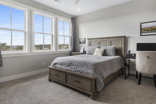 carpeted bedroom with multiple windows, recessed lighting, a ceiling fan, and baseboards