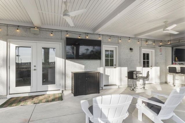 view of patio featuring french doors and ceiling fan