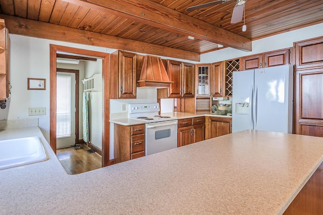 kitchen with beam ceiling, a sink, white appliances, wooden ceiling, and custom range hood