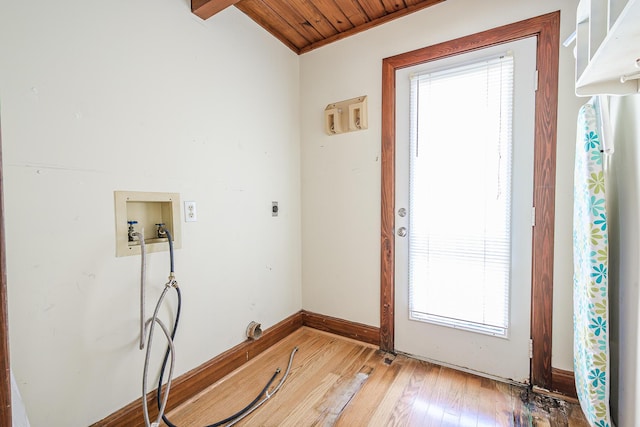 interior space with laundry area, hookup for a washing machine, light wood-style flooring, electric dryer hookup, and wood ceiling