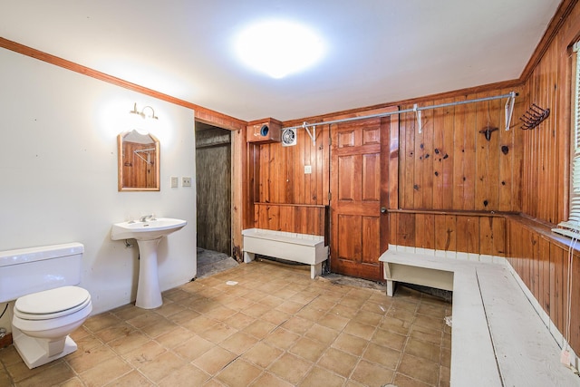 full bath with a sink, a stall shower, and toilet
