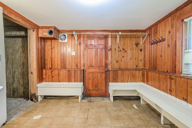 mudroom featuring wood walls
