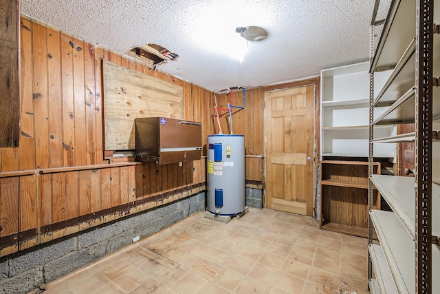 utility room featuring water heater