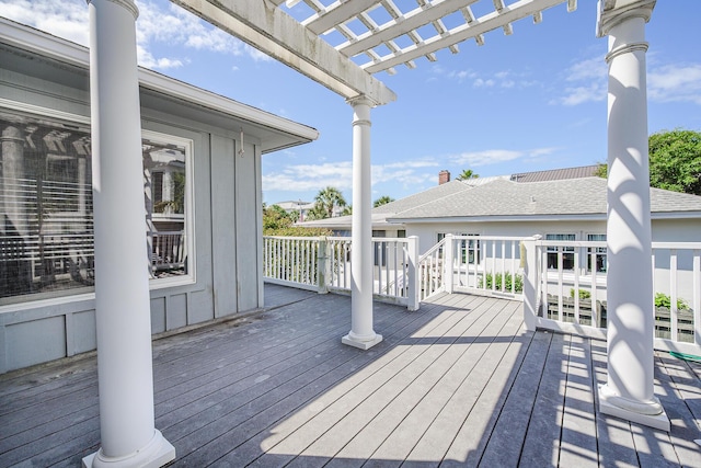 wooden terrace with a pergola