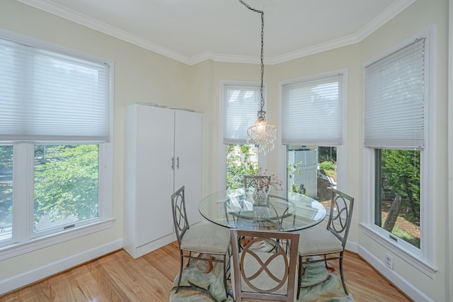 5847 Back Bay Dr, Isle Of Palms, SC 29451 - dining room with light wood-style flooring, crown molding, and baseboards