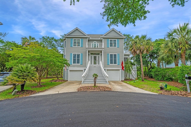 5847 Back Bay Dr, Isle Of Palms, SC 29451 - coastal inspired home featuring stairway, a garage, driveway, and a balcony