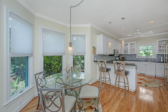5847 Back Bay Dr, Isle Of Palms, SC 29451 - dining area with light wood-style floors, ornamental molding, recessed lighting, baseboards, and a ceiling fan