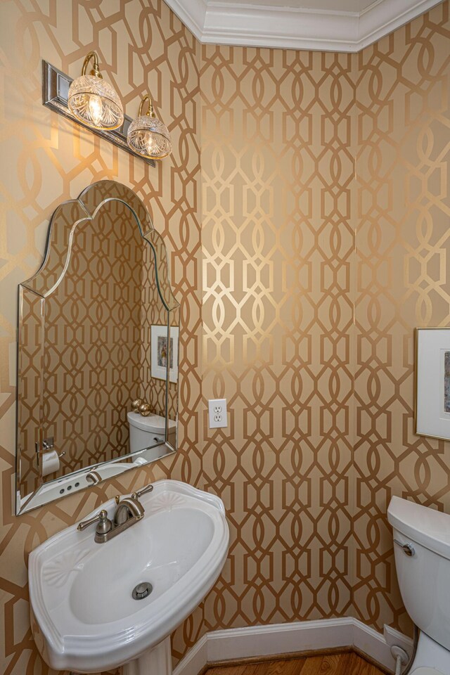 5847 Back Bay Dr, Isle Of Palms, SC 29451 - half bath with wallpapered walls, toilet, a sink, and crown molding